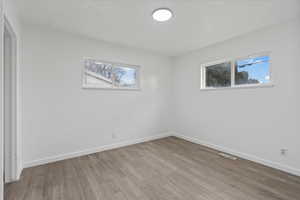 Spare room with light hardwood / wood-style flooring