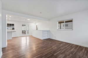 Unfurnished room with dark hardwood / wood-style flooring