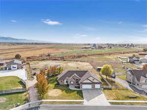 Birds eye view of property featuring a mountain view and a rural view