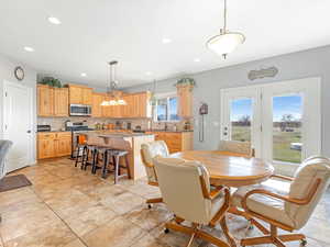 Tiled dining area featuring sink