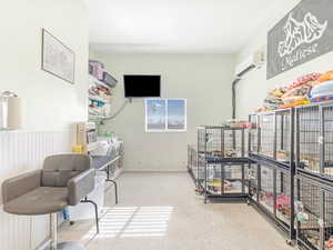 Interior space with washer and dryer and an AC wall unit