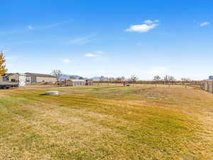 View of yard with a rural view