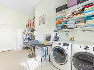 Laundry area featuring heating unit and washing machine and clothes dryer