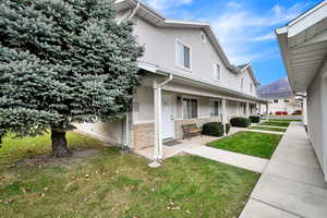 View of side of home featuring a yard