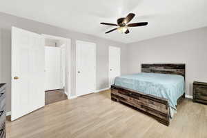 Bedroom featuring ceiling fan and light hardwood / wood-style flooring