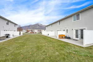 View of yard with a mountain view and a patio