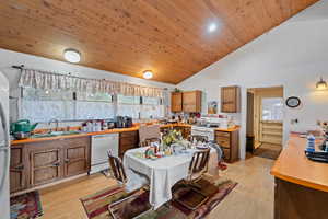 Dining room featuring light wood-type flooring, a wealth of natural light, and sink