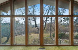 Doorway to outside featuring carpet flooring