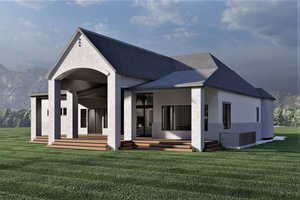 Back of house featuring a lawn and a mountain view