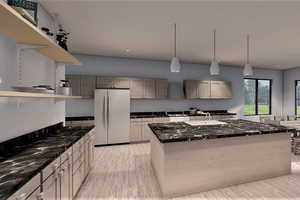 Kitchen with a center island, sink, hanging light fixtures, light hardwood / wood-style floors, and white fridge