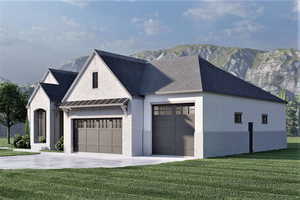 View of front of property featuring a front yard, a mountain view, and a garage