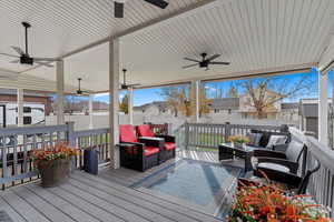 Deck with outdoor lounge area and ceiling fan