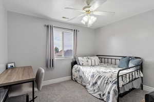 Carpeted bedroom with ceiling fan