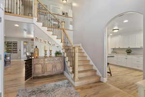 Staircase with hardwood / wood-style flooring