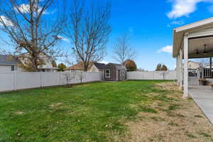 View of yard featuring a storage shed