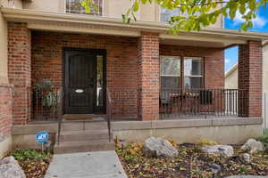 Entrance to property featuring a porch