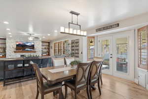 Dining area featuring ceiling fan, a healthy amount of sunlight, and light hardwood / wood-style flooring