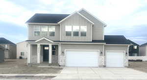 View of front of home featuring a garage