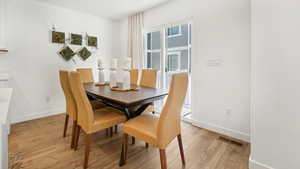 Dining room featuring light wood-type flooring