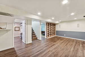 Basement with hardwood / wood-style floors