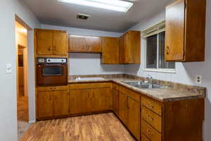 Kitchen featuring wood-type flooring