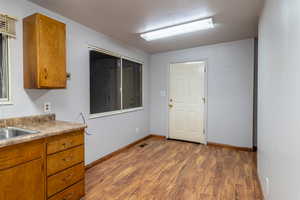 Kitchen with wood-type flooring