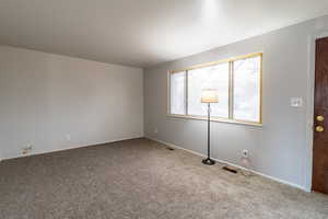 Unfurnished room featuring carpet floors