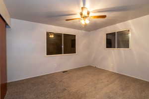 Master bedroom featuring ceiling fan