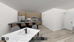 Dining room featuring light wood-type flooring and sink