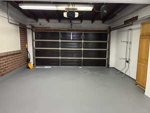 Garage featuring a garage door opener