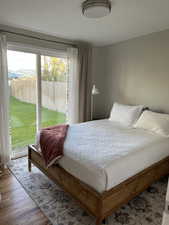 Bedroom with wood-type flooring