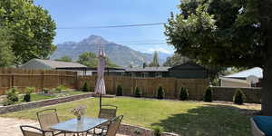 View of yard with a mountain view and a patio