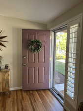 Foyer entrance featuring light hardwood / wood-style floors