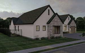 View of front facade with a front yard and a garage