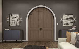 Foyer entrance with dark wood-type flooring