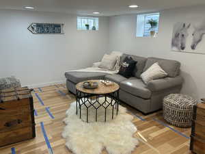 Living room with wood-type flooring