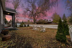 View of yard at dusk