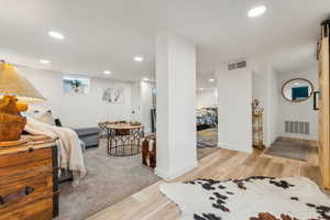 Bedroom with light hardwood / wood-style floors