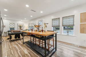 Office area with light hardwood / wood-style flooring