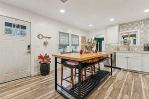 Dining room featuring sink and light wood-type flooring