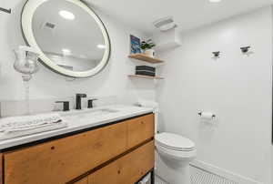 Full Bathroom featuring tile patterned flooring, vanity, and toilet