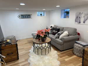 Living room with hardwood / wood-style flooring