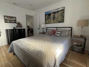 Bedroom with light hardwood / wood-style flooring