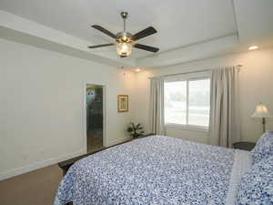 Master Bedroom,ensuite bathroom, a raised ceiling, and ceiling fan