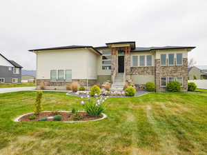 View of front of house featuring a front lawn