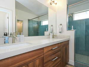 Master Bathroom featuring vanity and an enclosed shower