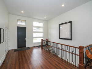 Entryway featuring dark wood-type flooring