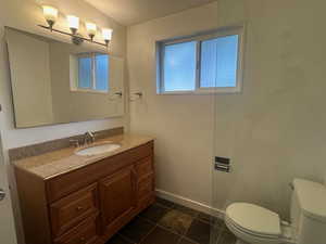 Bathroom with vanity and toilet