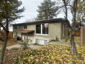 Back of property featuring a patio area and cooling unit