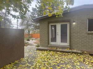 View of exterior entry featuring french doors